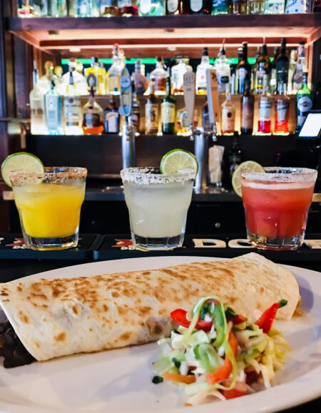 View of 3 drinks and a burrito